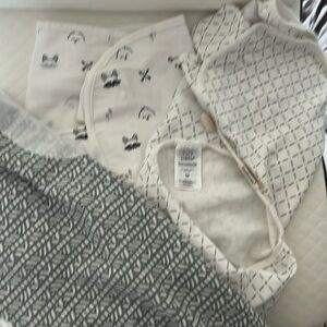 Swaddles never worn. 0-3 months.
